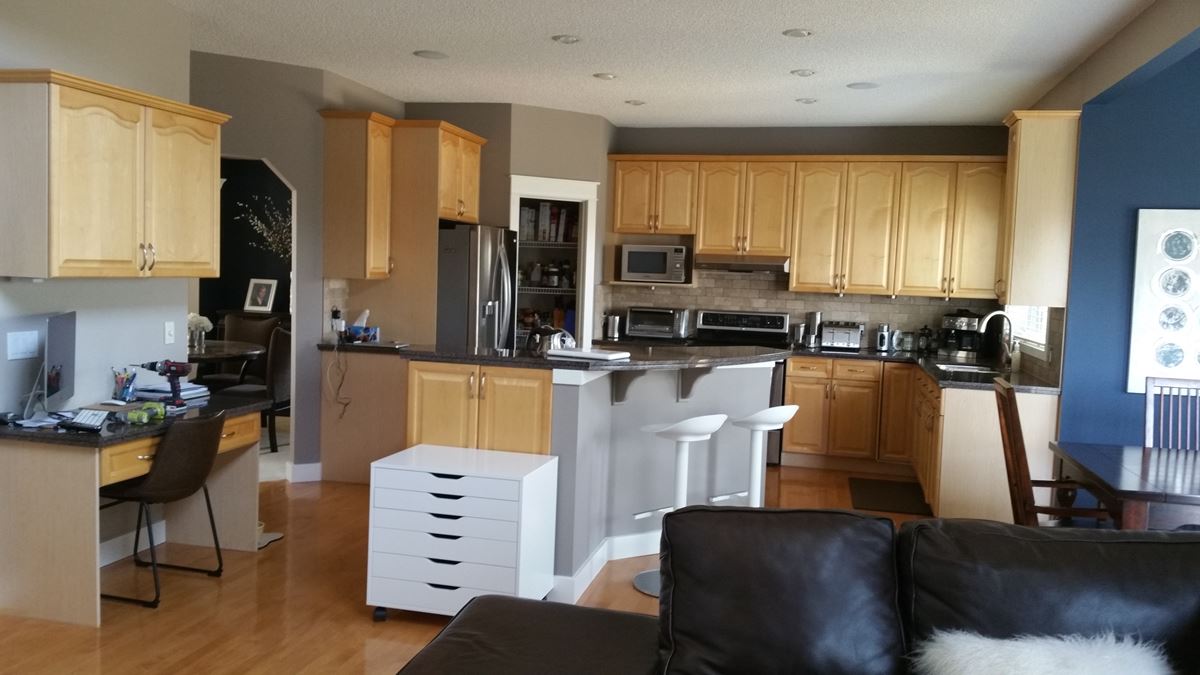 Modern spacious yellow maple kitchen before painting