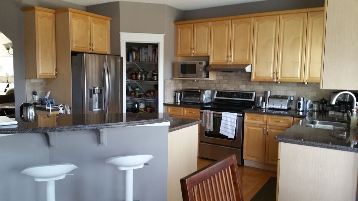 Yellow maple modern kitchen before painting