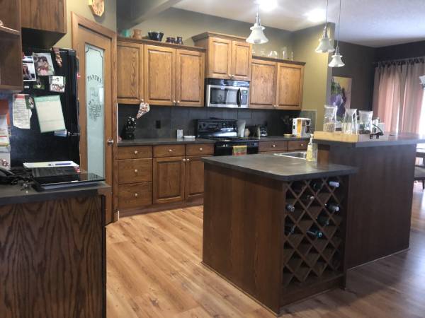 Okotoks rustic dark stain kitchen before painting