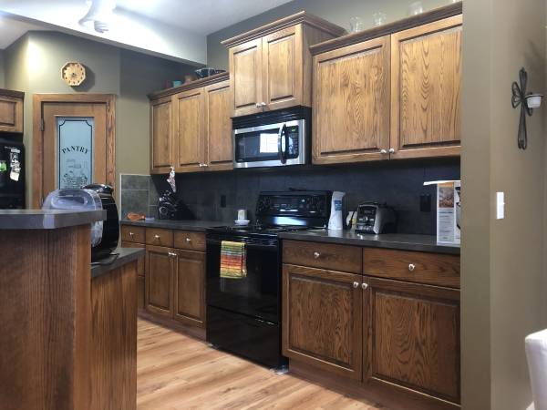 Okotoks rustic dark stain kitchen before painting