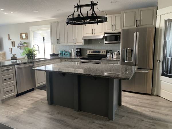 Cochrane light grey painted kitchen with dark grey accent island