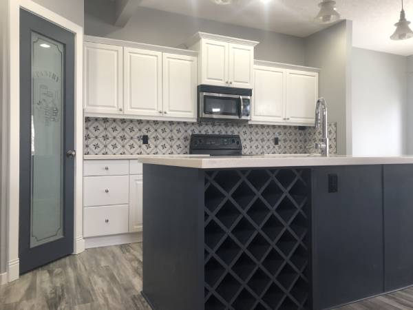 Modern two-tone white and navy painted kitchen Okotoks