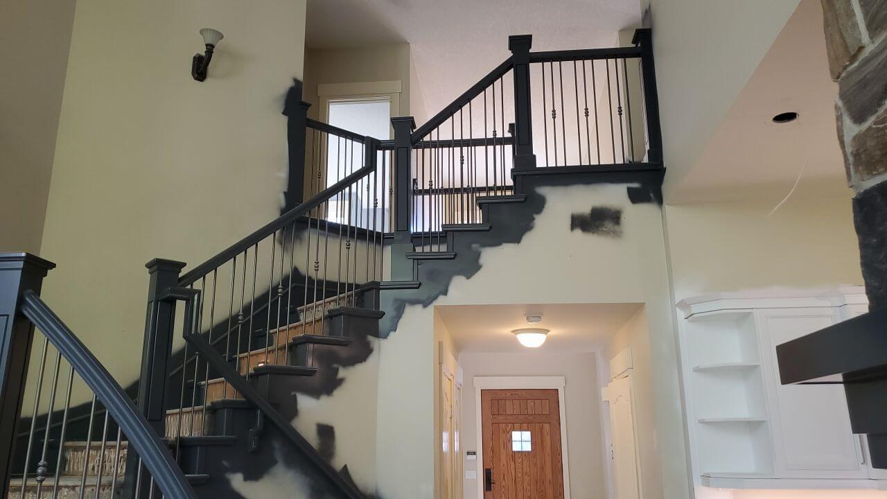 Dark grey painted banister railing SW Calgary