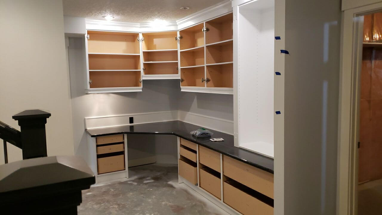 Modern white painted basement desk before re-install