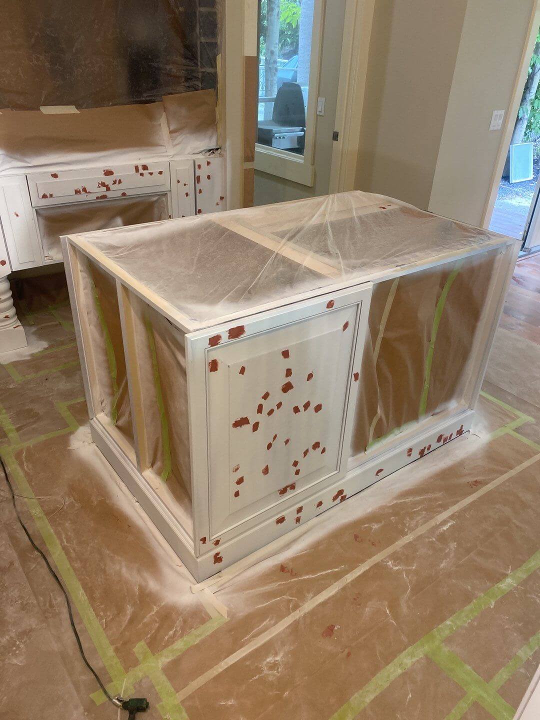 Prepped and primed kitchen island under renovation