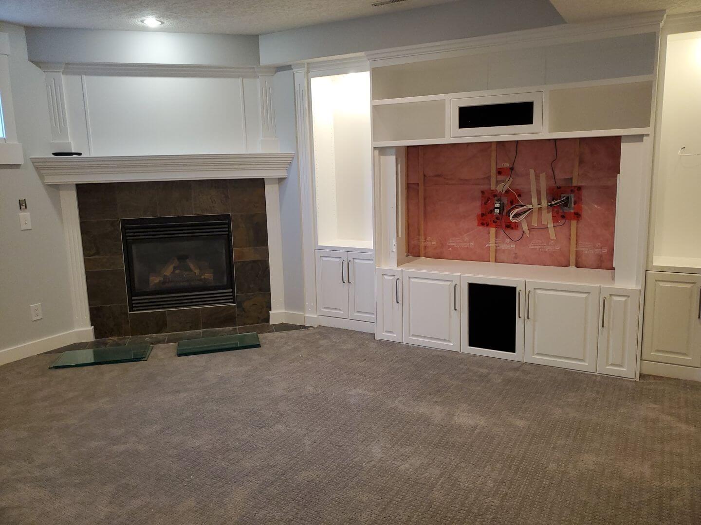 Basement TV stand and fireplace mantel painted modern white