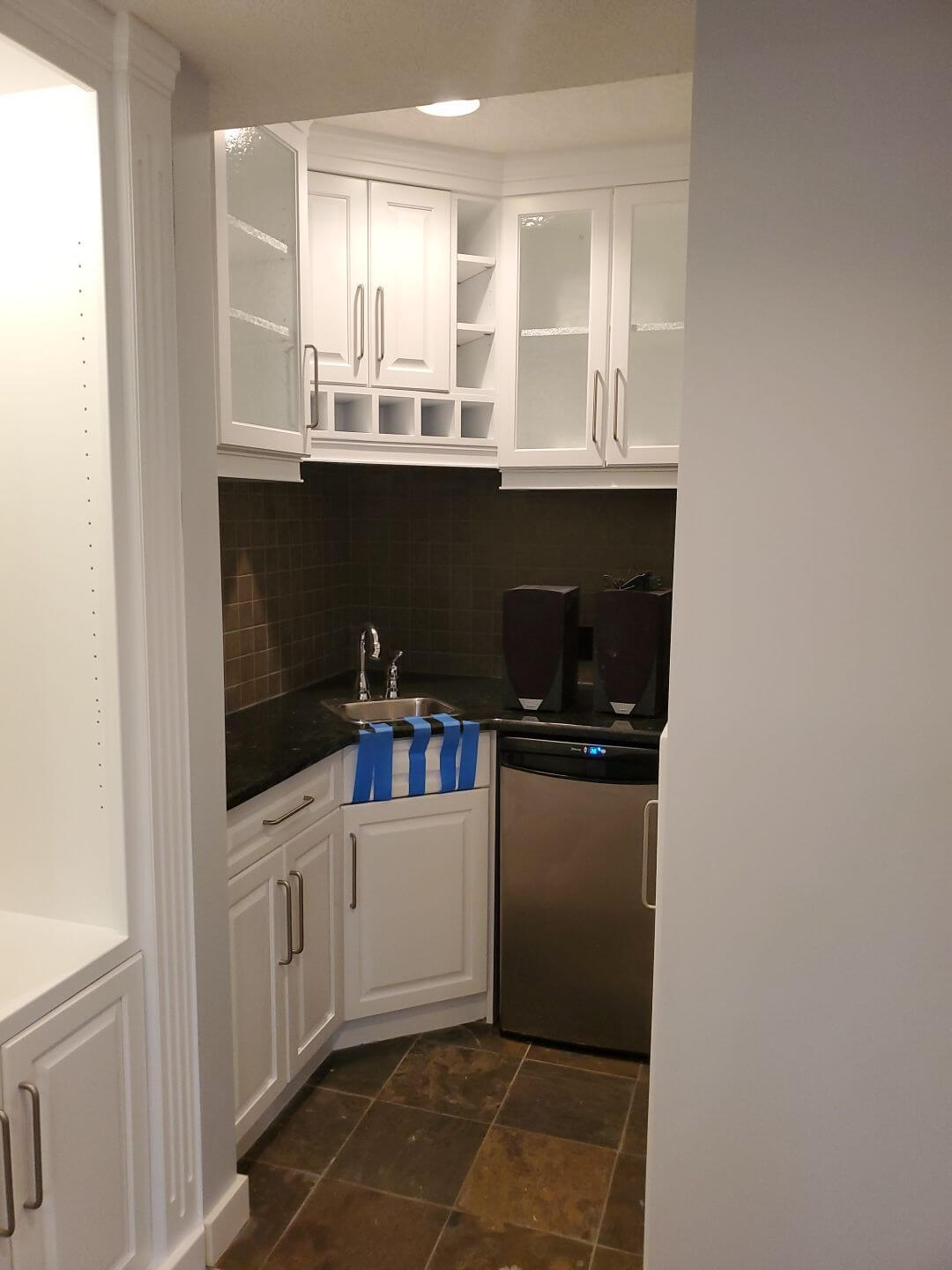 Basement bar cabinets painted modern white in SW Calgary