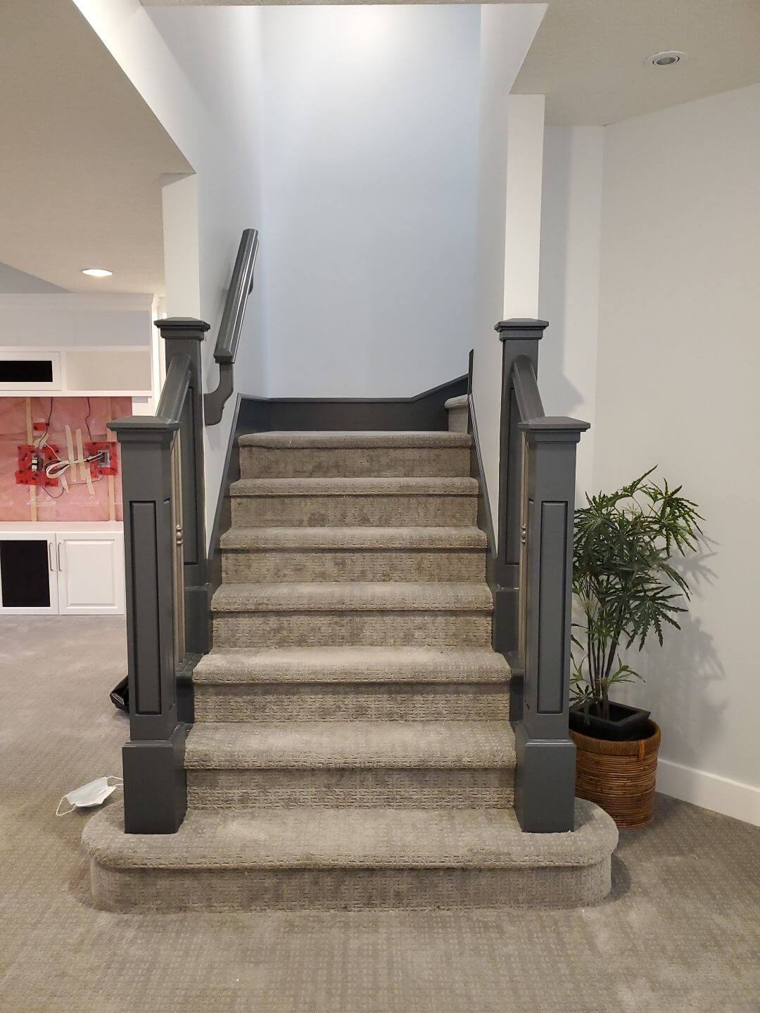 Dark grey painted basement banister in SW Calgary