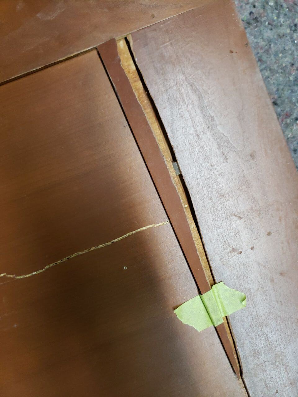 Damaged cabinet door in need of repair