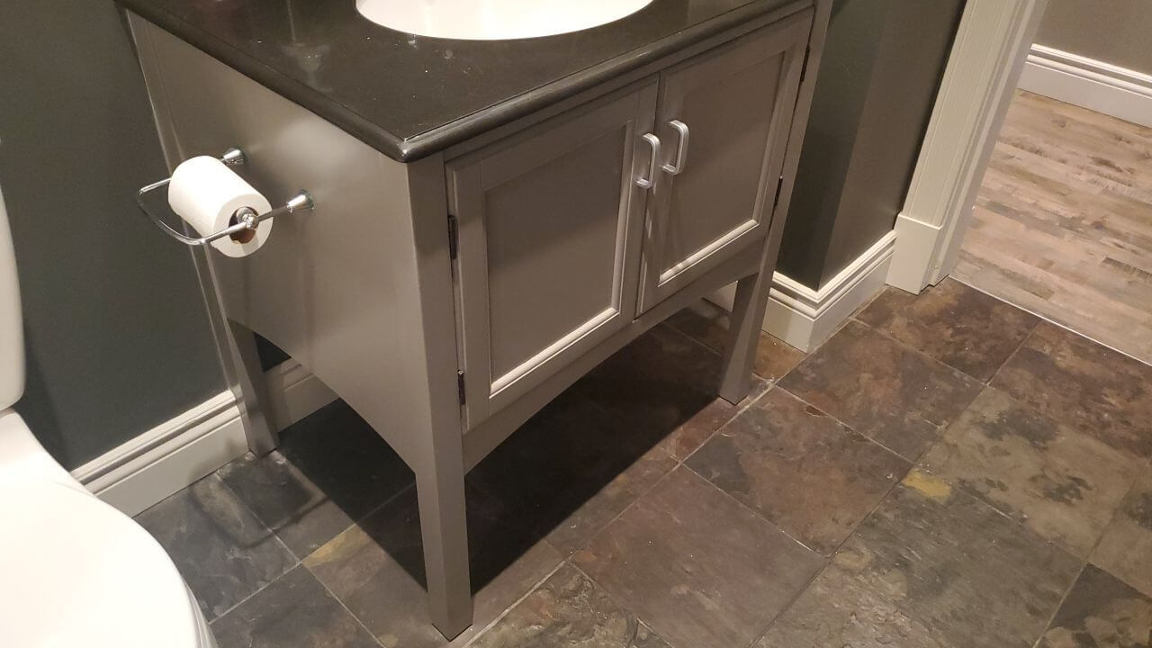 Small bathroom vanity painted a chic grey