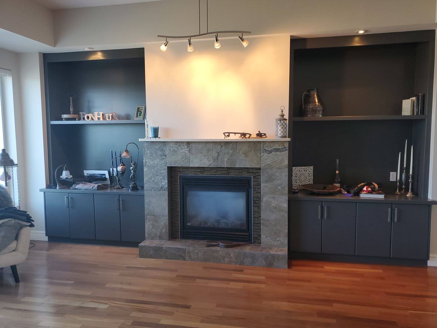 Dark Grey built-in cabinetry with light grey painted fire place mantel