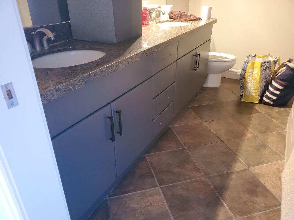 Dark grey painted master bathroom cabinetry downtown Calgary