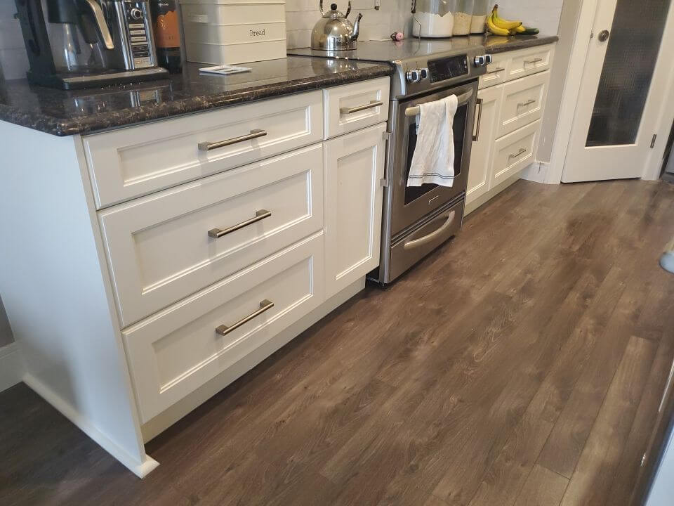 Modern white painted lower cabinetry and drawers