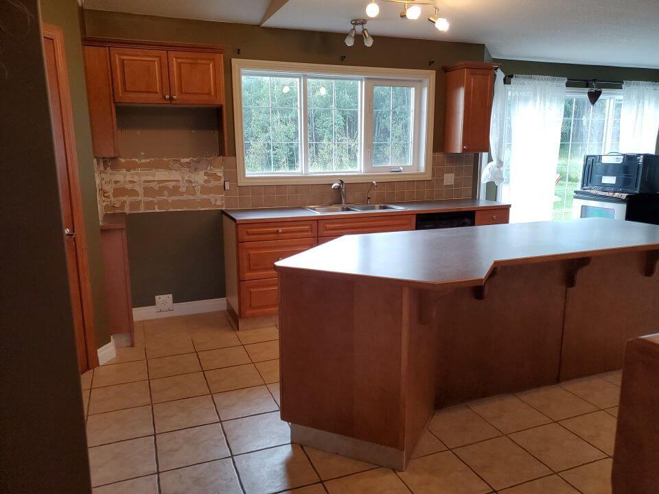 Stained wood kitchen before painting in Water Valley