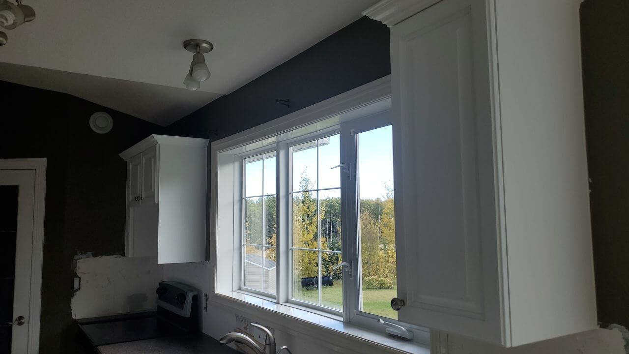 Matching white painted central kitchen window Water Valley