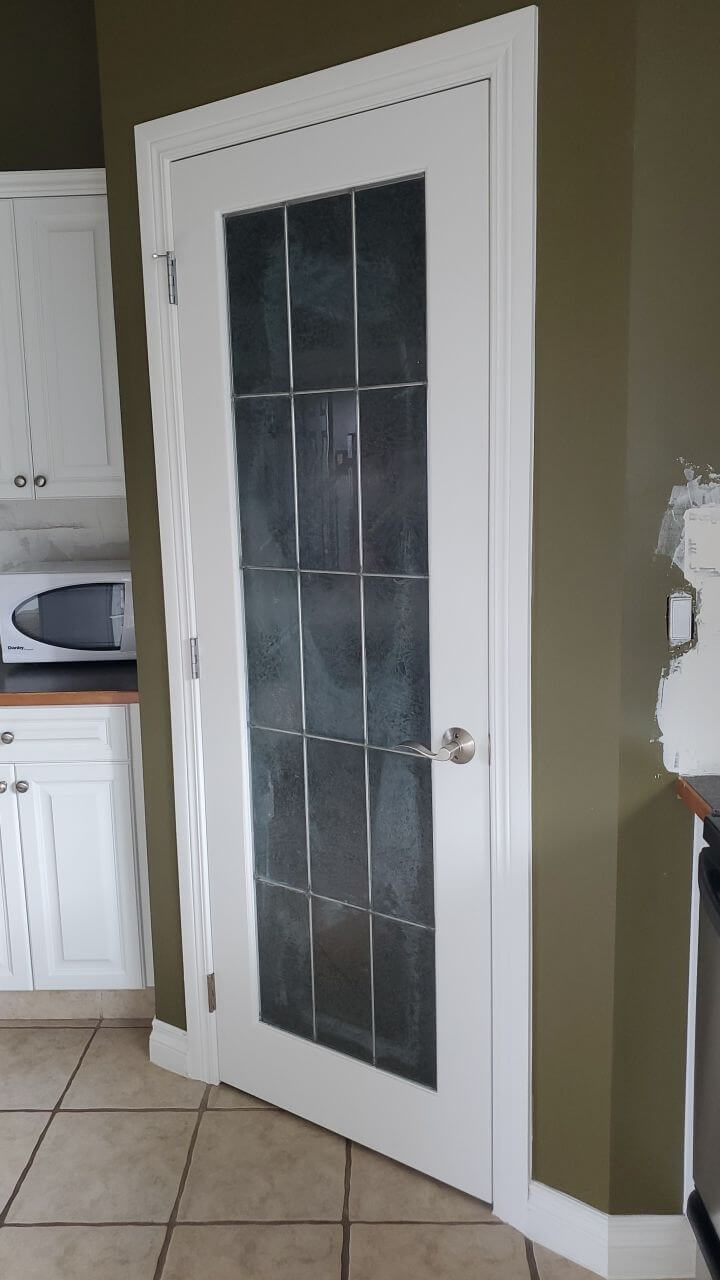 Matching white painted pantry door in Water Valley