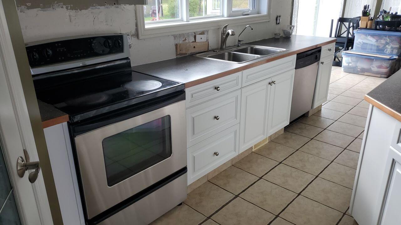 Modern white painted lower cabinets in Water Valley