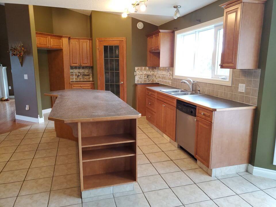 Stained wood kitchen before painting in Water Valley