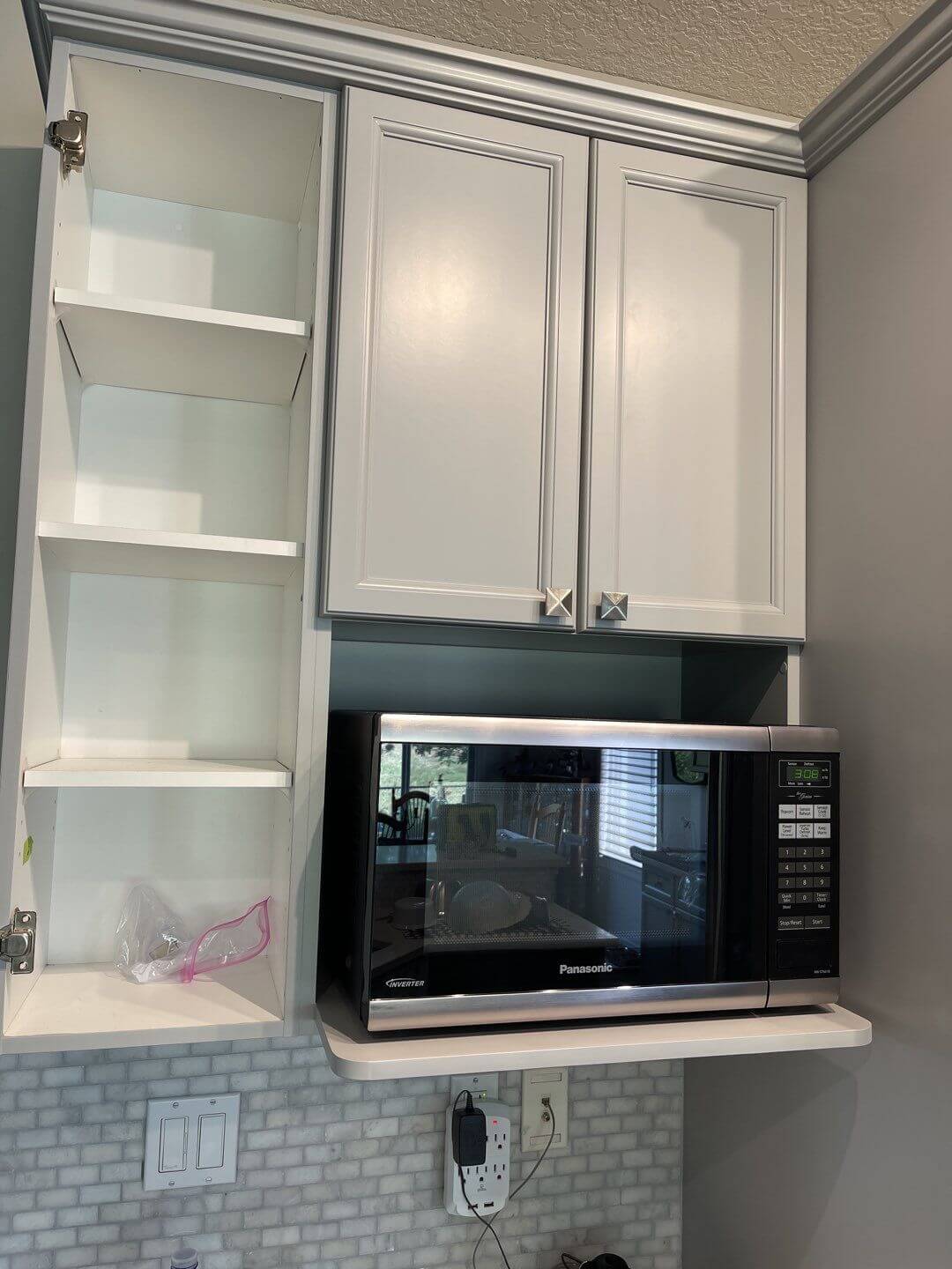 Grey painted microwave shelf cabinetry Okotoks