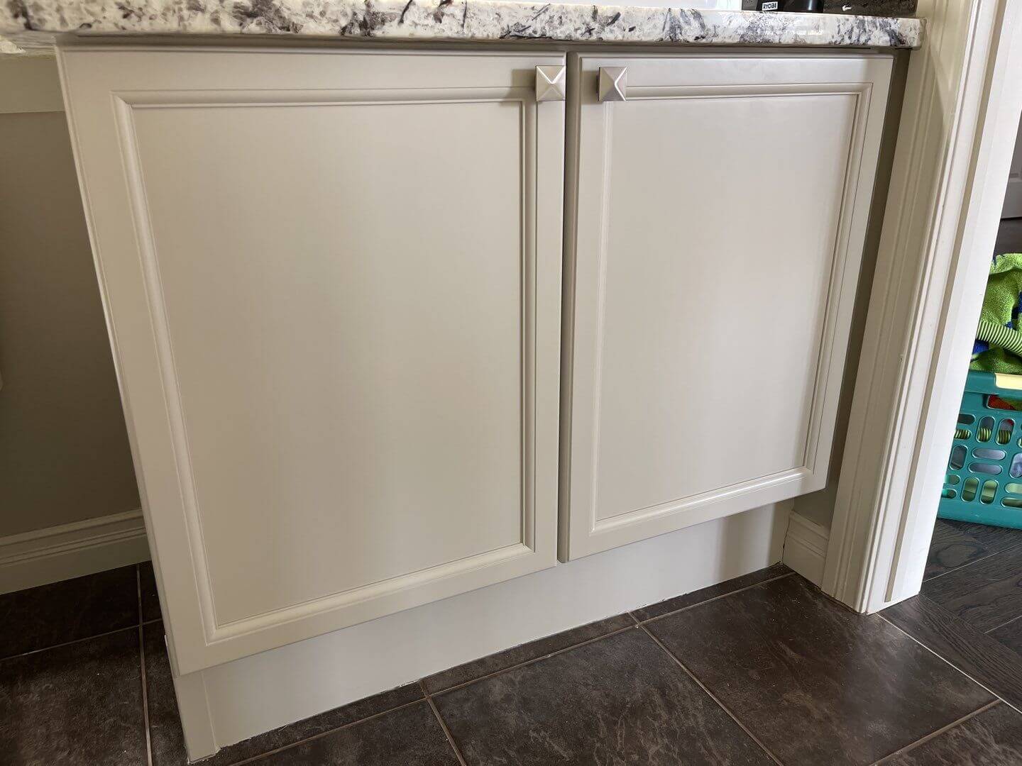 Grey painted bathroom unit with stylish hardware