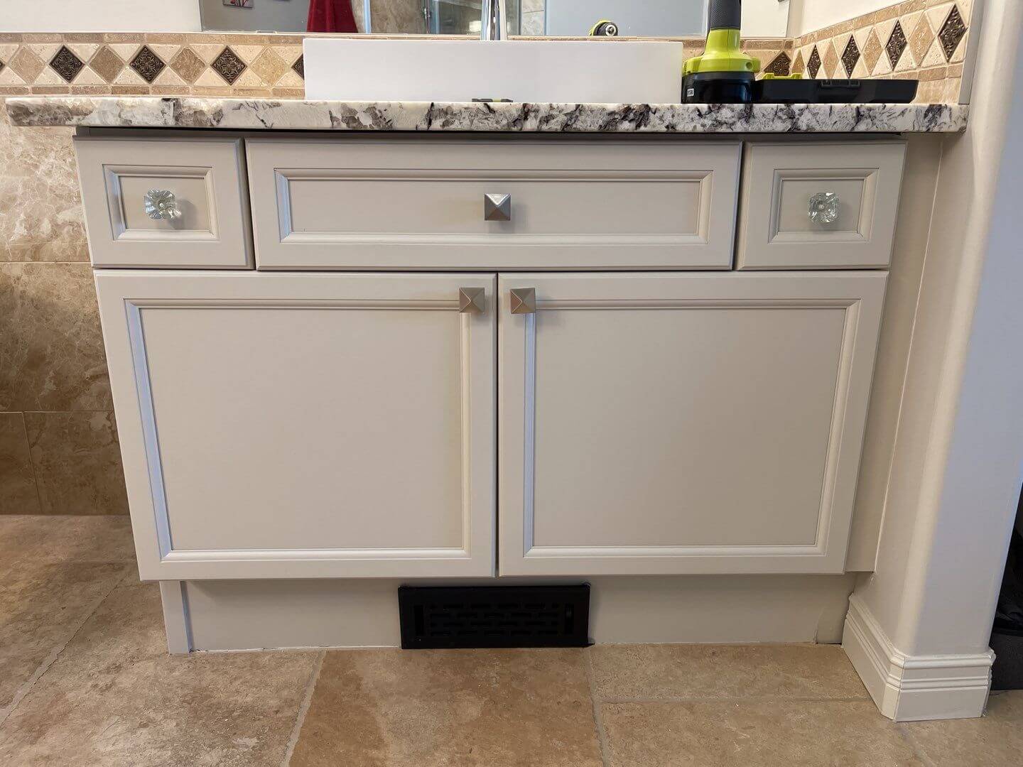 Grey painted bathroom unit with stylish hardware