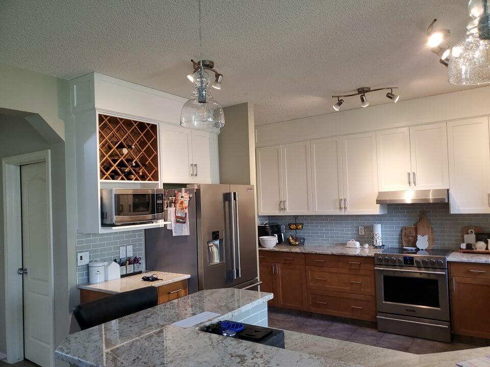 Modern white painted upper kitchen cabinets SW Calgary