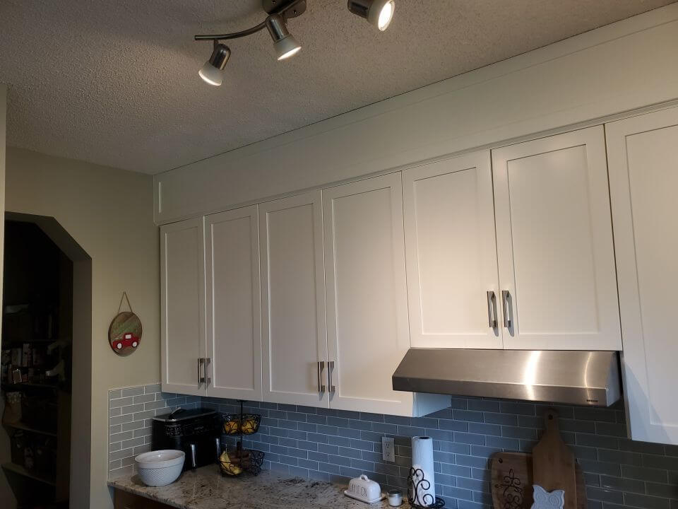 SW Calgary modern white painted cabinets with chic silver hardware