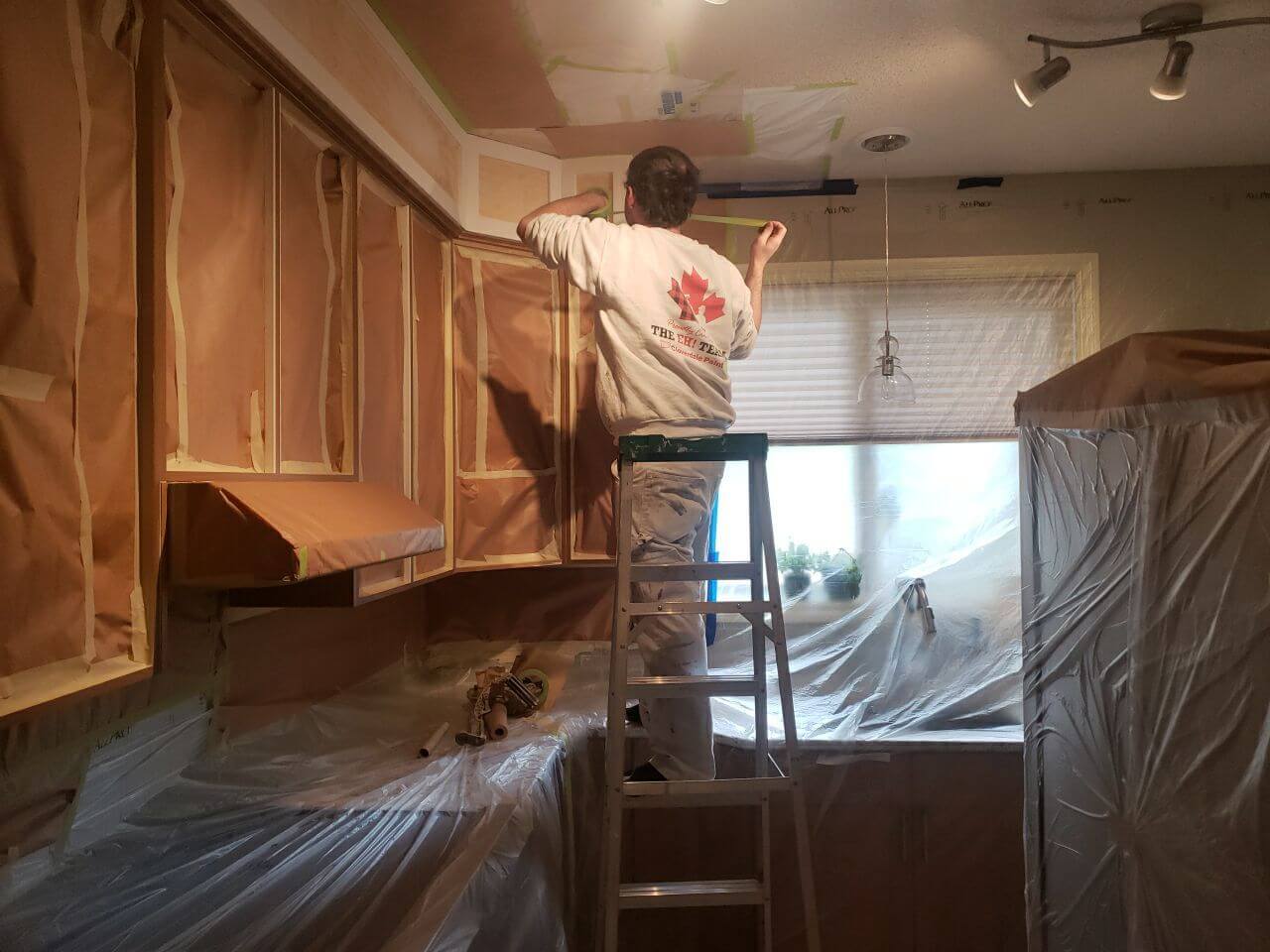 Prepping kitchen cabinets for paint SW Calgary