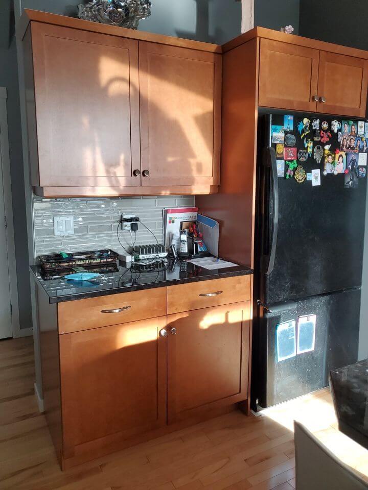 Orange maple fridge tower cabinets before painting