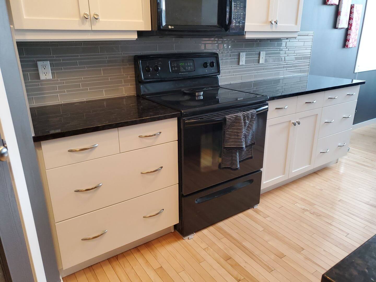 Painted white lower cabinetry and drawers