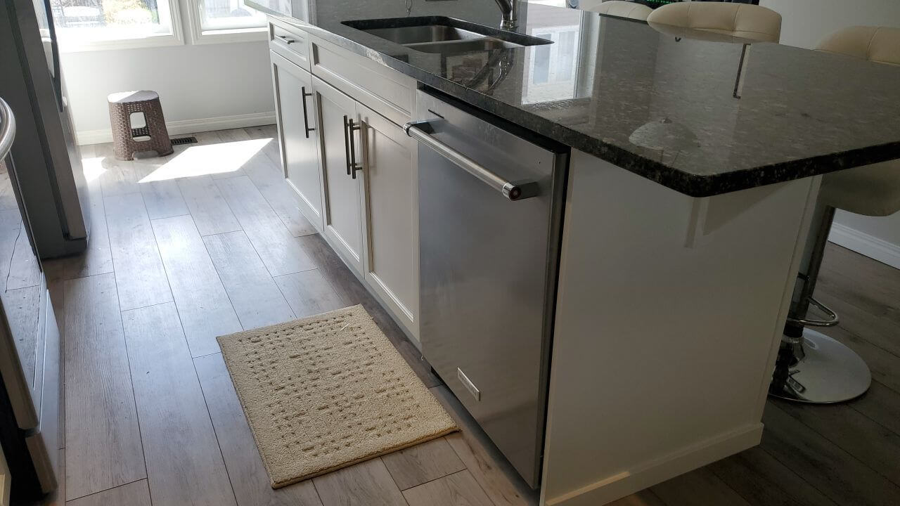 Chic white island with dark countertops