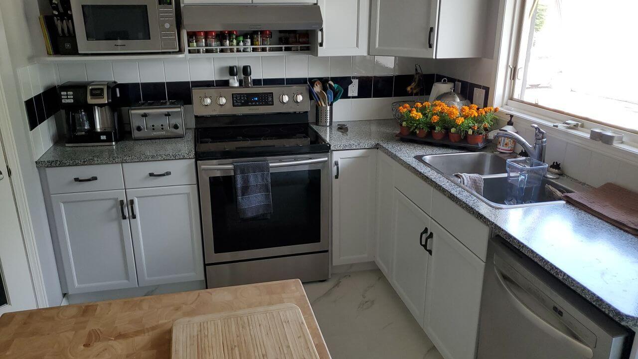 White upper cabinetry with light grey accent lowers