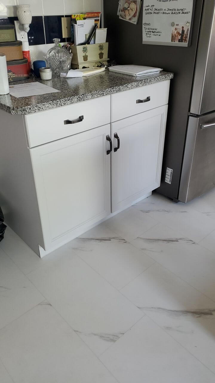 Light grey cabinetry featuring black accent hardware