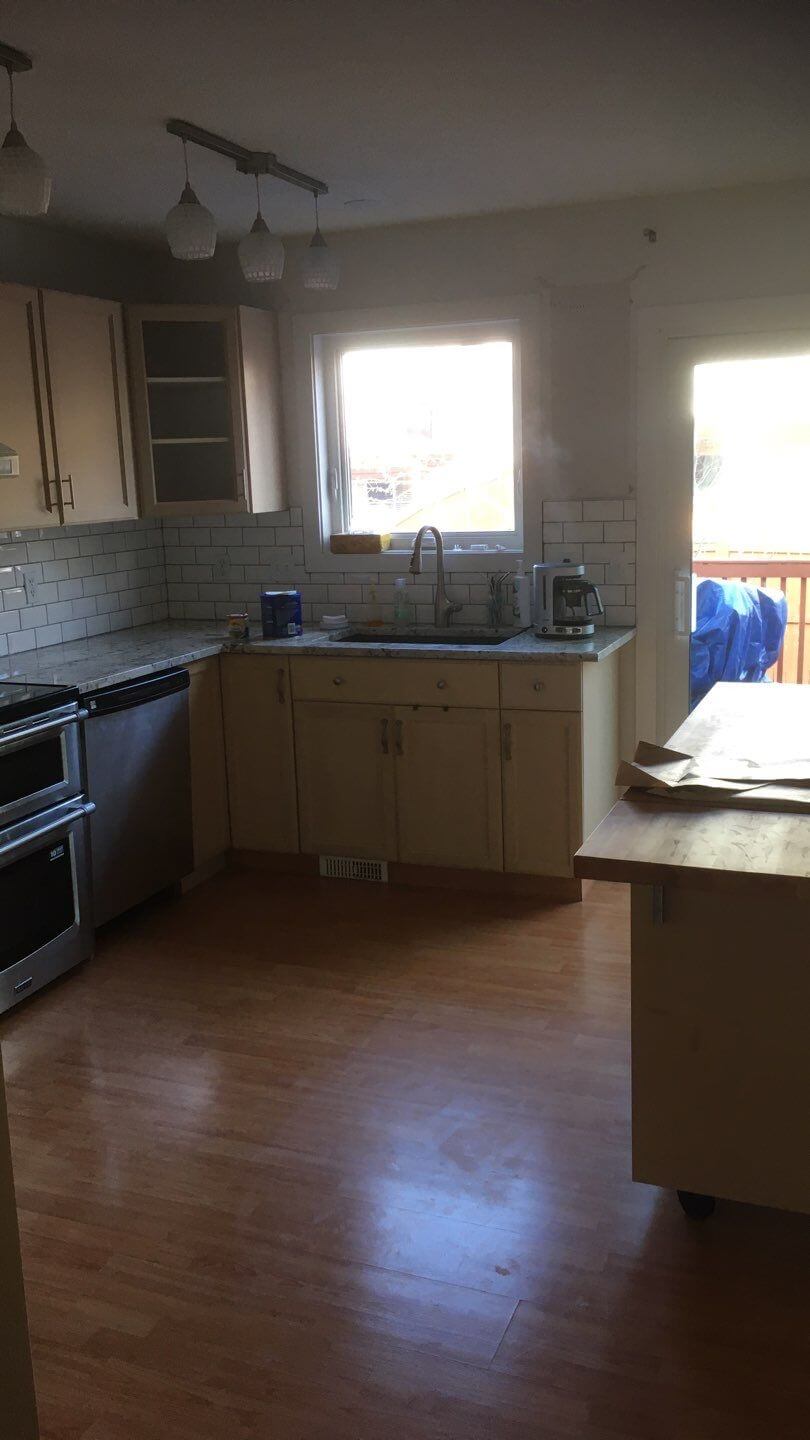 Cozy corner kitchen prior to being painted