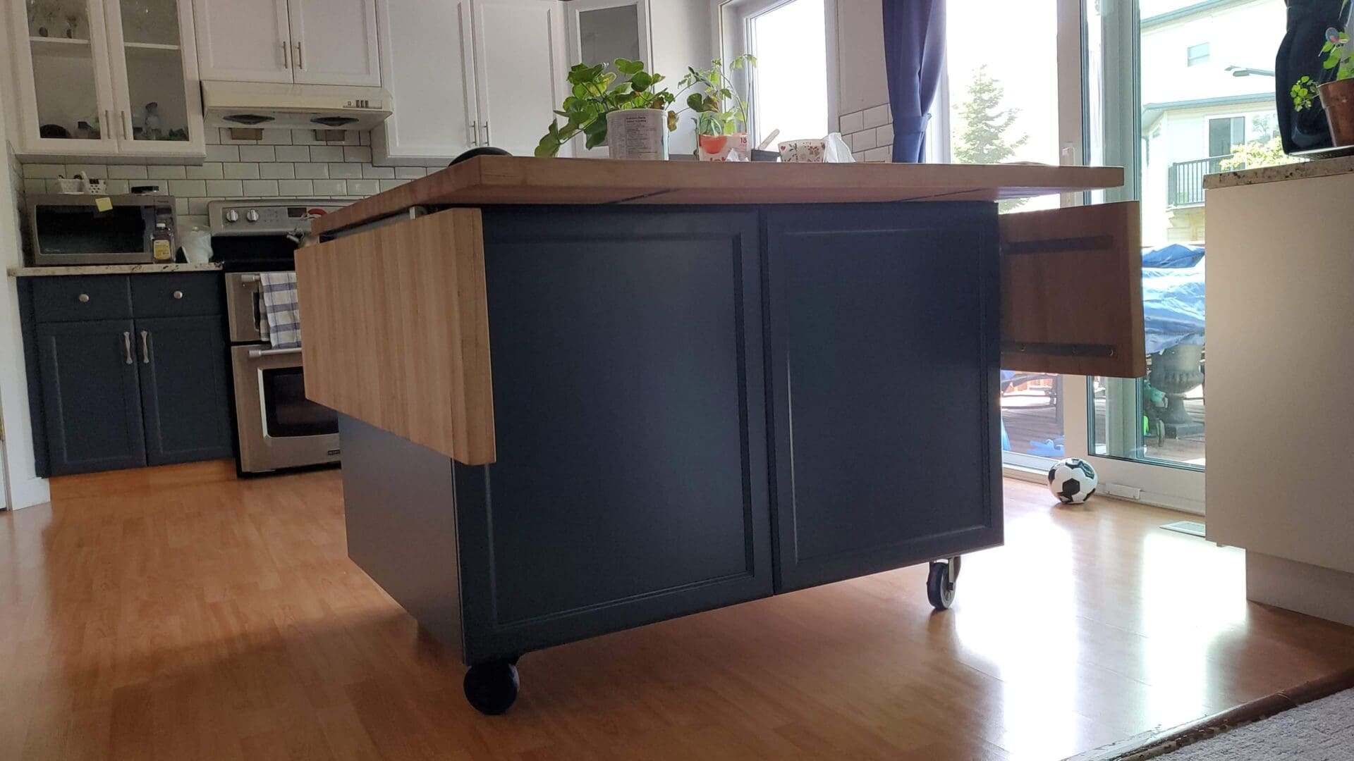 Navy blue island with chic white upper cabinets