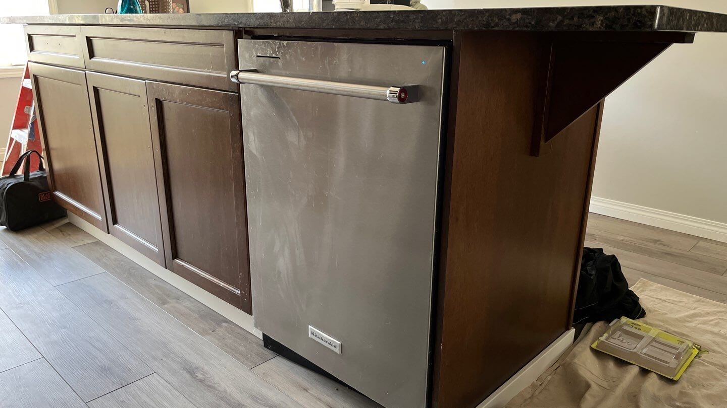 before photo of brown cabinetry island