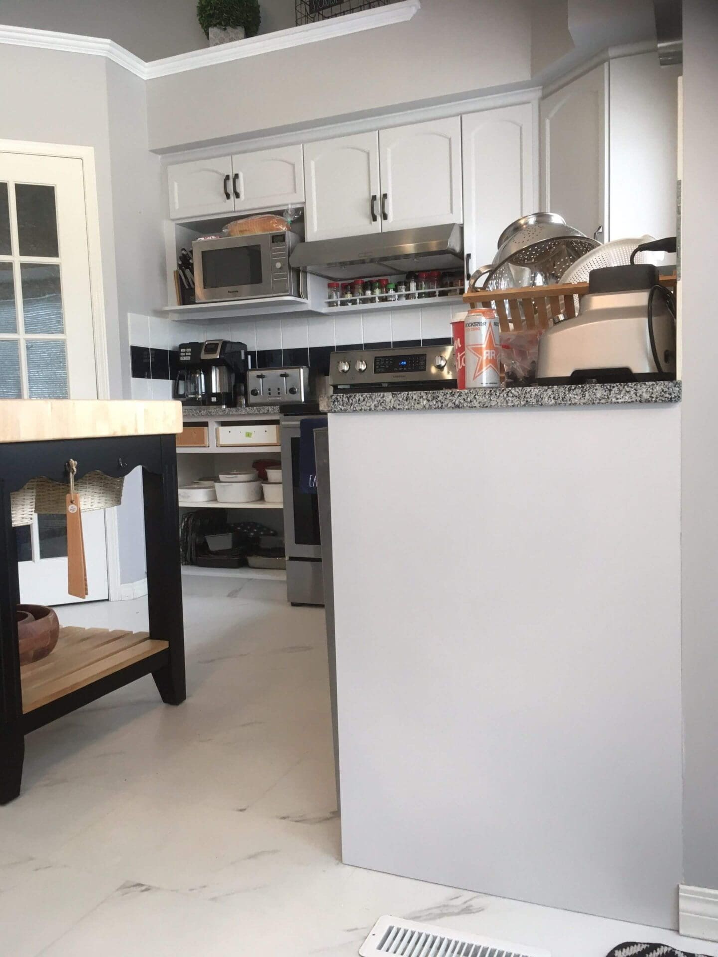 Light grey lower cabinets with bright white uppers